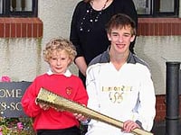 Olympic torch-bearer makes school's day