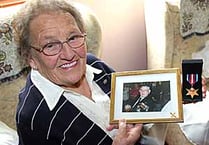 Liz’s pride over husband’s medal