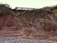 Couple move back to their cliff-edge home