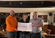 Charity auction coins in cash for Alzheimer's UK