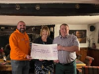 Charity auction coins in cash for Alzheimer's UK