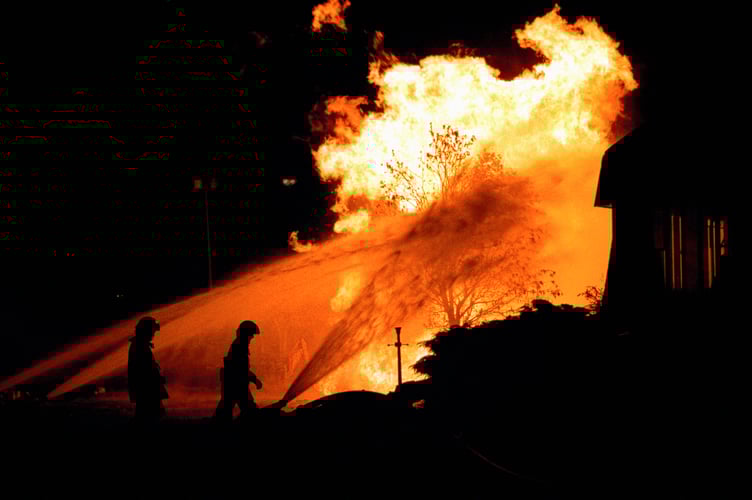 Firefighters at the scene of the gas explosion in Runcorn, Cheshire, which left four people badly burned.