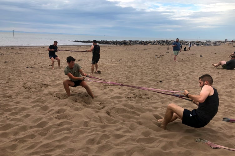 Rugby club train on the beach