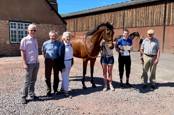 Thyme Hill owners Andrew Heywood and Tony and Beth England with Tom OÕBrien and Philip Hobbs at Sandhill Racing Stables after winning The 2021 Ryanair Stayers Hurdle at Aintree.