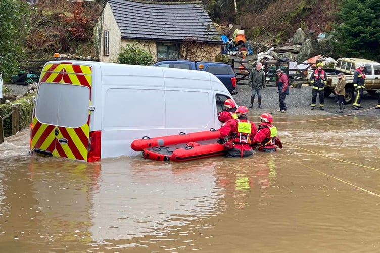 Firefighters rescue a motorist at Exford