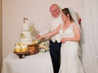 Wedding cake prize cut at third attempt