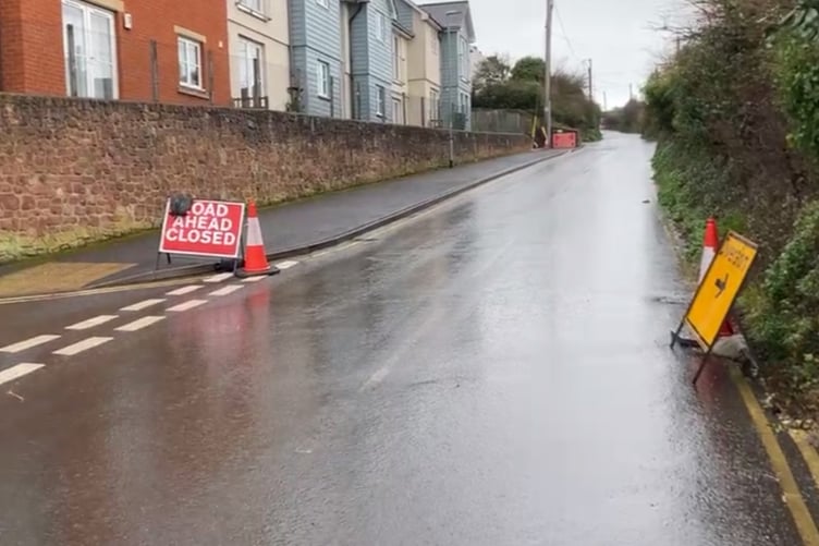 The closed B3191 Cleeve Hill seen from the Watchet side