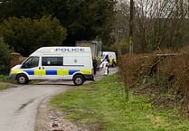 Police cordon off village and arrest man on suspicion of murder