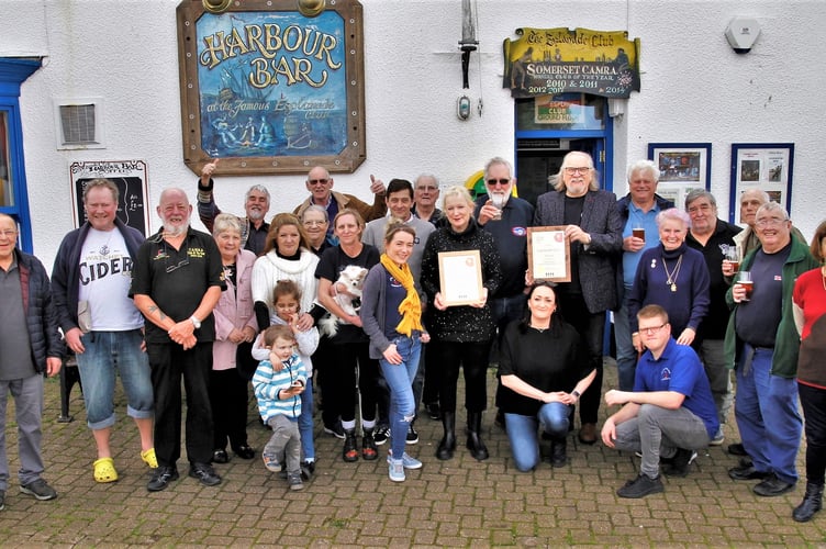 Roy and Helen Chave, who run the Esplanade Club, proudly hold their two winners’ certificates as they celebrate with customers