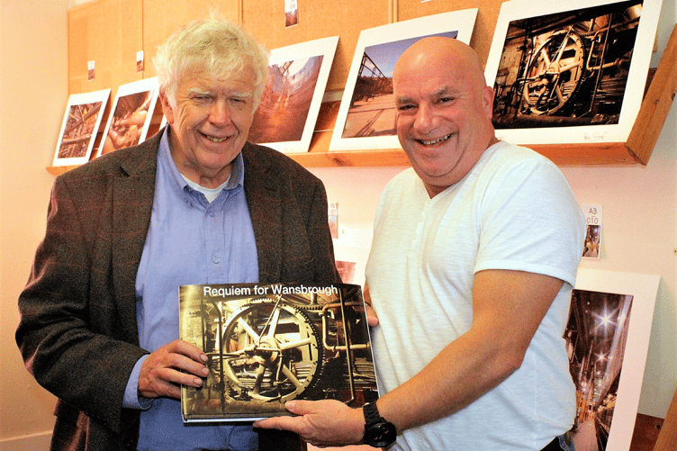 Bob Cramp and Chris Northam, of Wansbrough paper mill, hold the book ‘Requiem for Wansbrough’, a photographic record of the redundant mill machinery