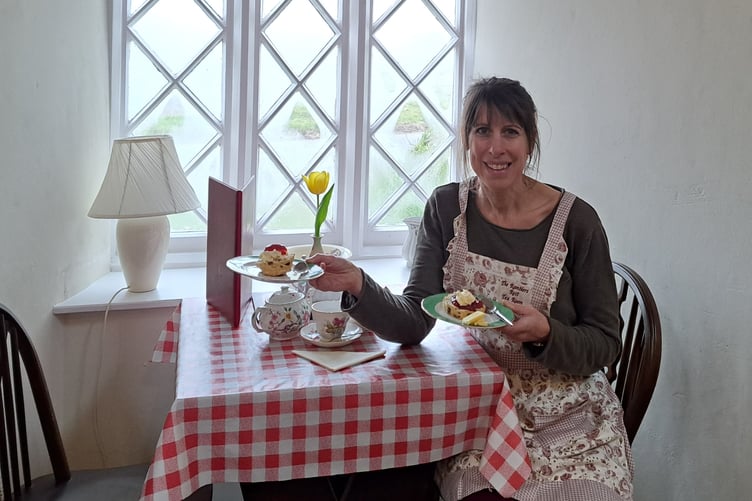 Jessica Chipperfield with a choice of cream tea, jam first or cream first.