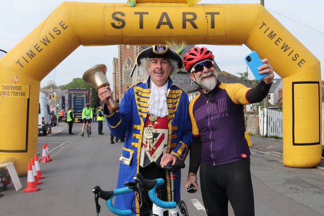 Coast to coast cycle: One cyclist takes the opportunity to take a selfie with town crier David Milton  