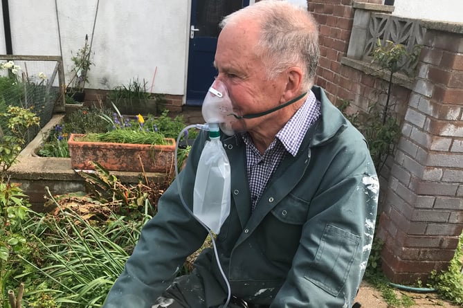 Blue Anchor fire hero Bob King receives oxygen before being taken to hospital.