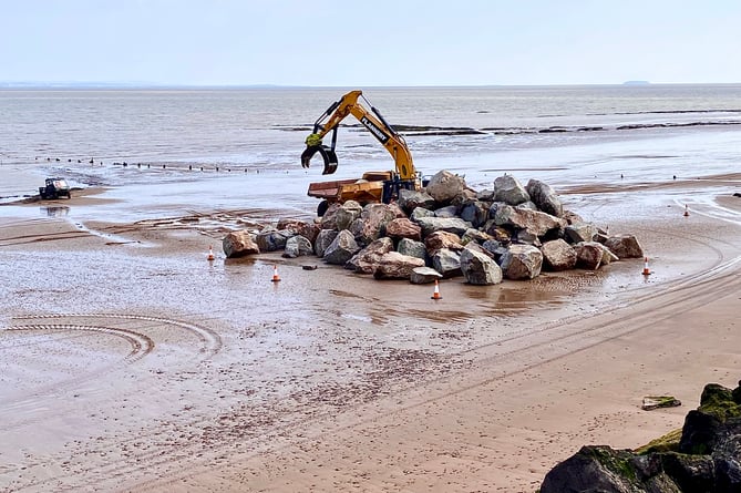 Blue Anchor rock armour being moved on the beach as work started this week.