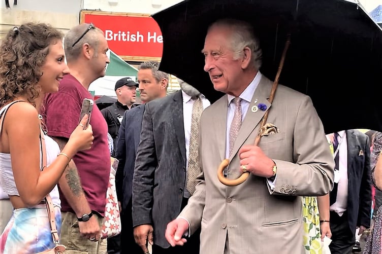 The then Prince of Wales hats to Scarlett Hills-Brooks, trainee journalist at the West Somerset Free Press, on his visit to West Somerset three years ago