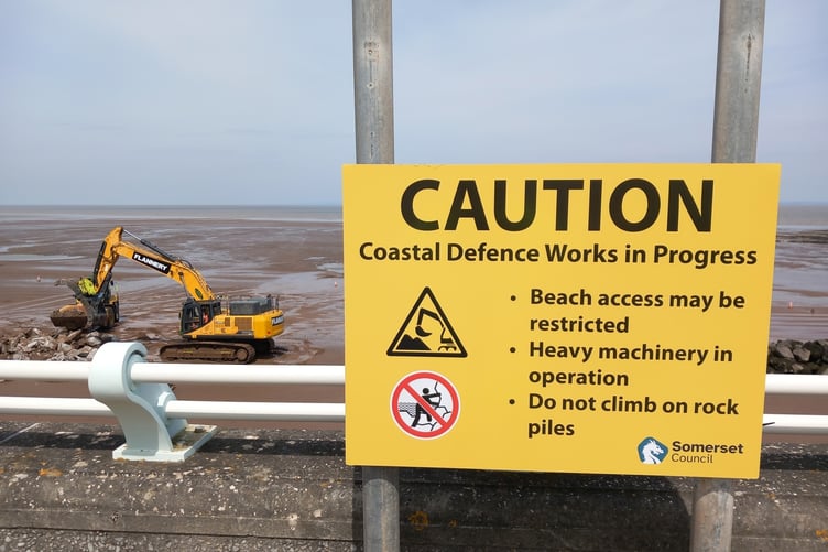 Heavy machinery is being used on Blue Anchor beach to move rock armour.