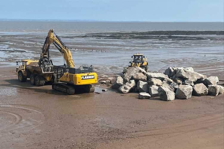 Rock armour being moved on Blue Anchor beach.