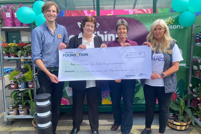 At the cheque presentation were (left to right) Morrisons Minehead duty manager Adam Rawle-Ashby, play area trustees chairman Kathy Walker, Timberscombe parish clerk Lesley Webb, and Morrisons community champion Sharon Mainwaring.