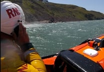 Lifeboat crew and coastguards rescue stranded walker