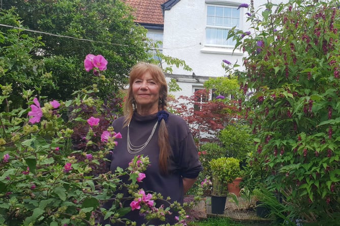 Pam Leach in the garden of the Porlock home from which she is being evicted.