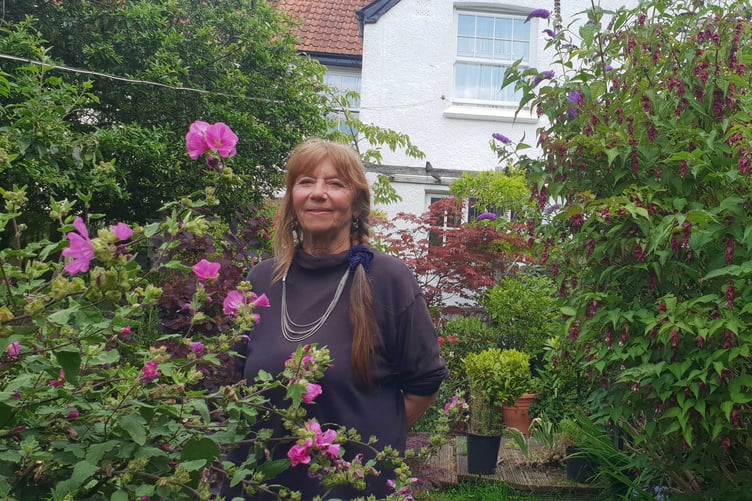 Pam Leach in the garden of the Porlock home from which she is being evicted.