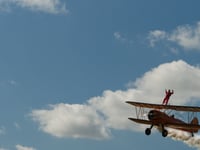 Biplane stunt supports cancer charity