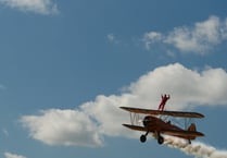 Biplane stunt supports cancer charity