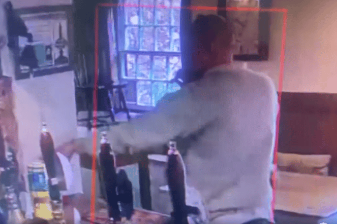 Captured on CCTV, the moment a man takes a charity pot from the bar of the Royal Oak Inn, Luxborough.
