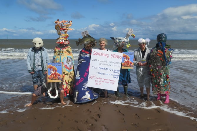 'Dirty Water' campaigners protest on Minehead beach against raw sewage dumping.