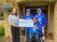 Shanty singers present £1,500 to hospice