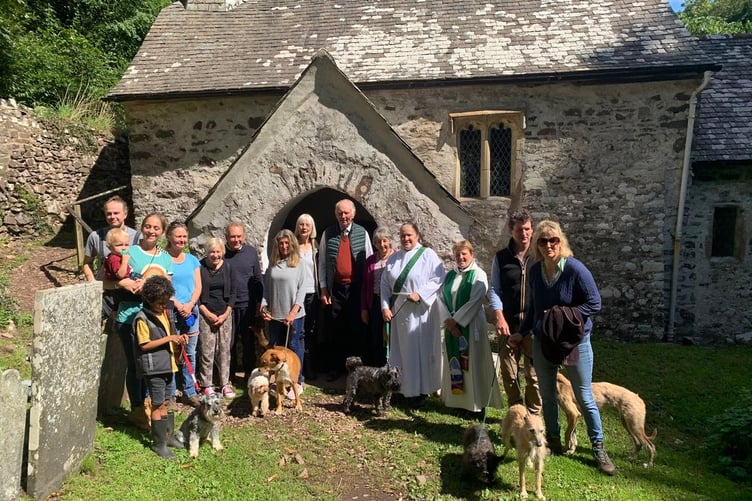 The Revs Ann Gibbs and Nicola Butt with some of those attending the ‘walk your dog to church’ family service in Culbone.