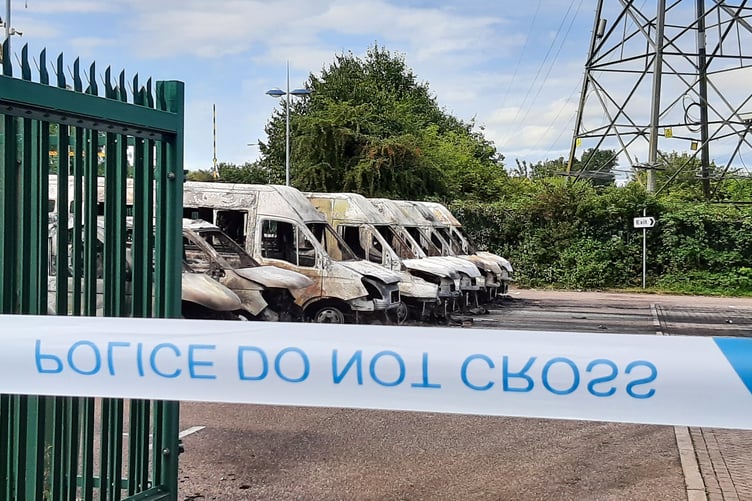 The burnt out minibuses at the park and ride site in Silk Mills, Taunton.