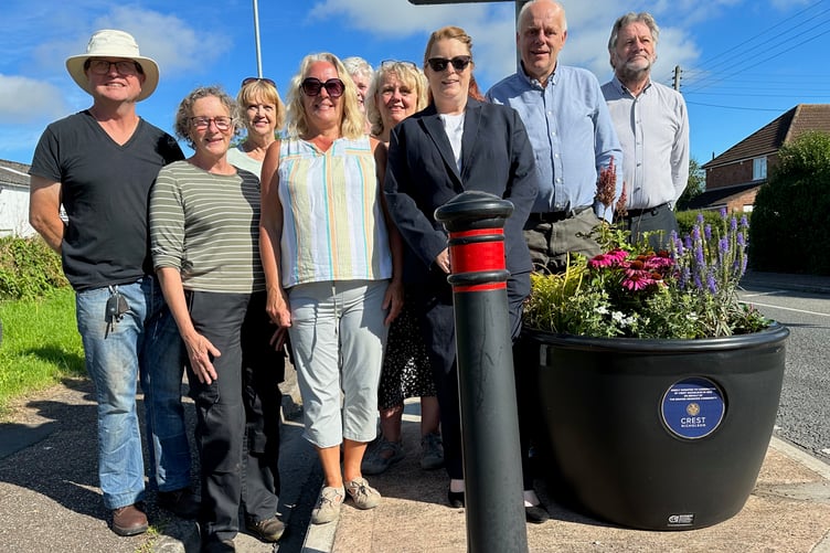 Cannington in Bloom members and parish councillors celebrate the Crest Nicholson planters gift.