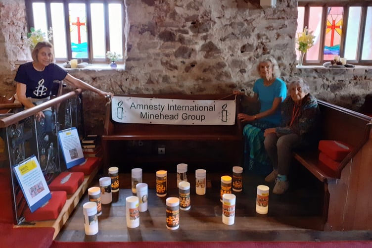 Minehead Amnesty International members Alison Dietz, Cherry Bird, and Philippa Gerry during their vigil.