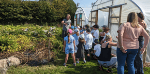 Pupils visit community garden to learn about vegetables