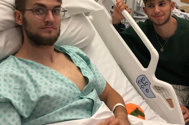 Finn Webber, recovering in a hospital bed in Cotford St Luke, is visited by his brother Sam.