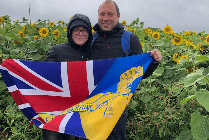 West Somerset Ukrainian Choir leader Alex Parvak with a local youngster.