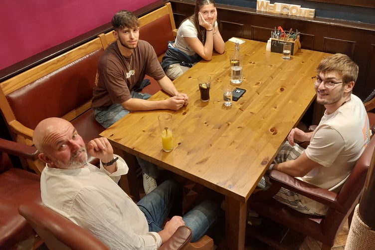 Finn Webber (right) pictured on a short hospital leave with his father Dan, brother Sam, and sister Isobel.