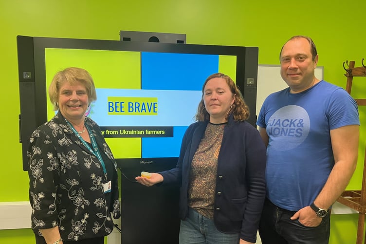 Somerset Cllr Rob Wyke (left) with Kateryna Luchyna and Olexander Pervak, who have started a business named Bee Brave.