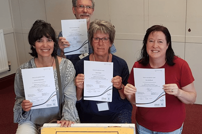 Volunteers from Minehead’s Hope Centre Trust with their First Aid certificates after training funded by Magna.