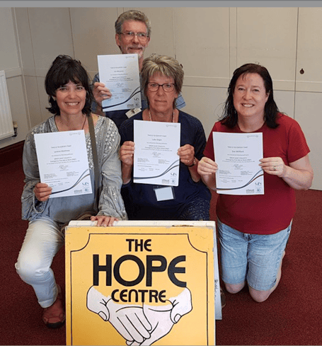 Volunteers from Minehead’s Hope Centre Trust with their First Aid certificates after training funded by Magna.