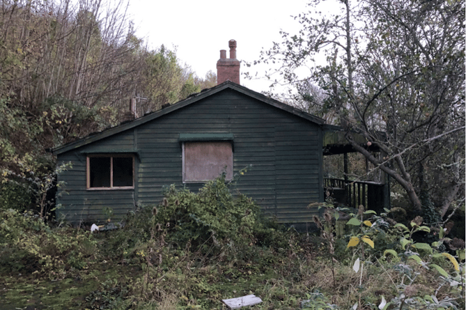 The derelict wooden Hurlstone Bungalow which is proposed to be replaced with a new off-grid eco home.
