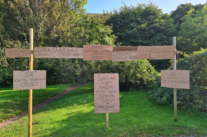 Protest messages on display in Bossington as residents attended a mass demonstration against plans to replace Hurlstone Bungalow.