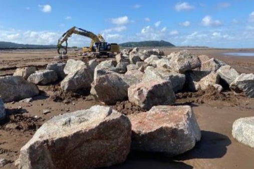 Granite rock armour being installed on Minehead beach.