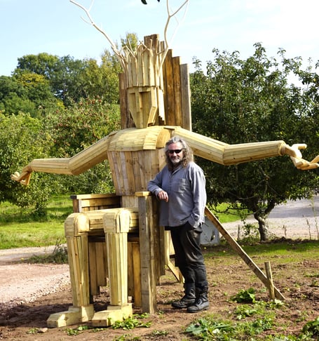 Artist Rob Heard with his 'Torm Man' sculpture which will be set alight on Saturday.