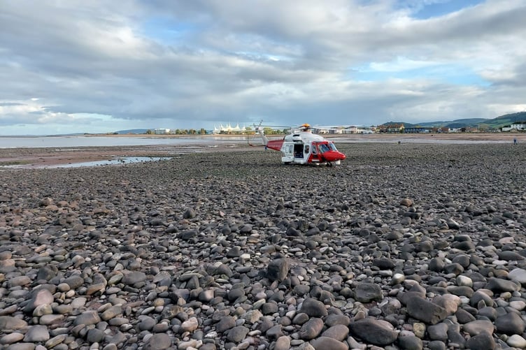 A Coastguard helicopter on Minehead beach during Sunday's harbour drama.