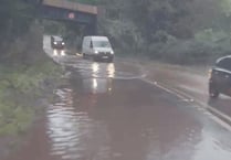 Flood partially closes main road