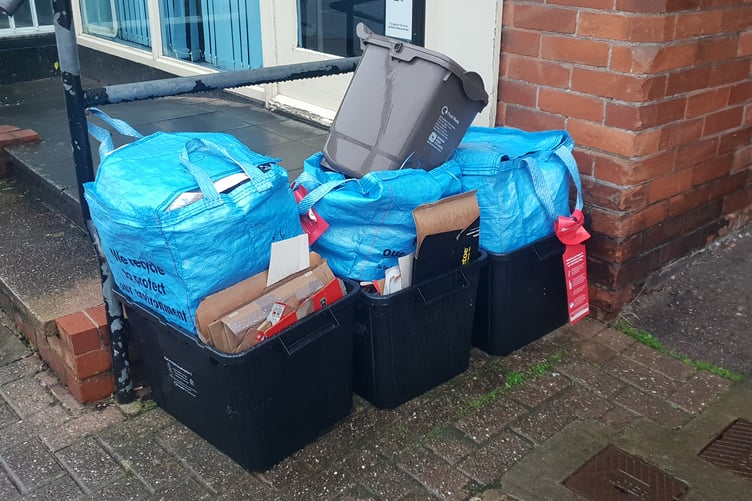 Recycling bins awaiting collection.