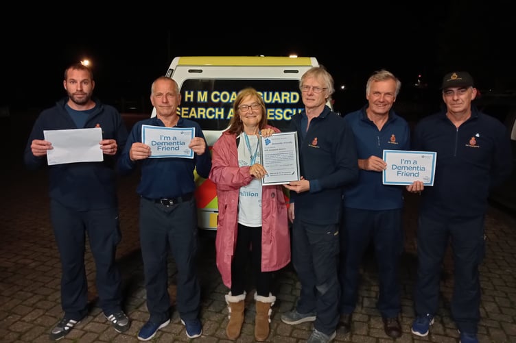 Margaret Tatham, of Watchet and the Quantocks Dementia Action Alliance, with Watchet Coastguards led by station officer Mike Champion.