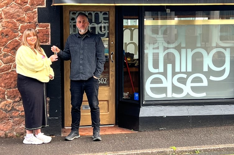 Hairdresser Dan James gives the keys to his Minehead salon to new owner Alana Buck.